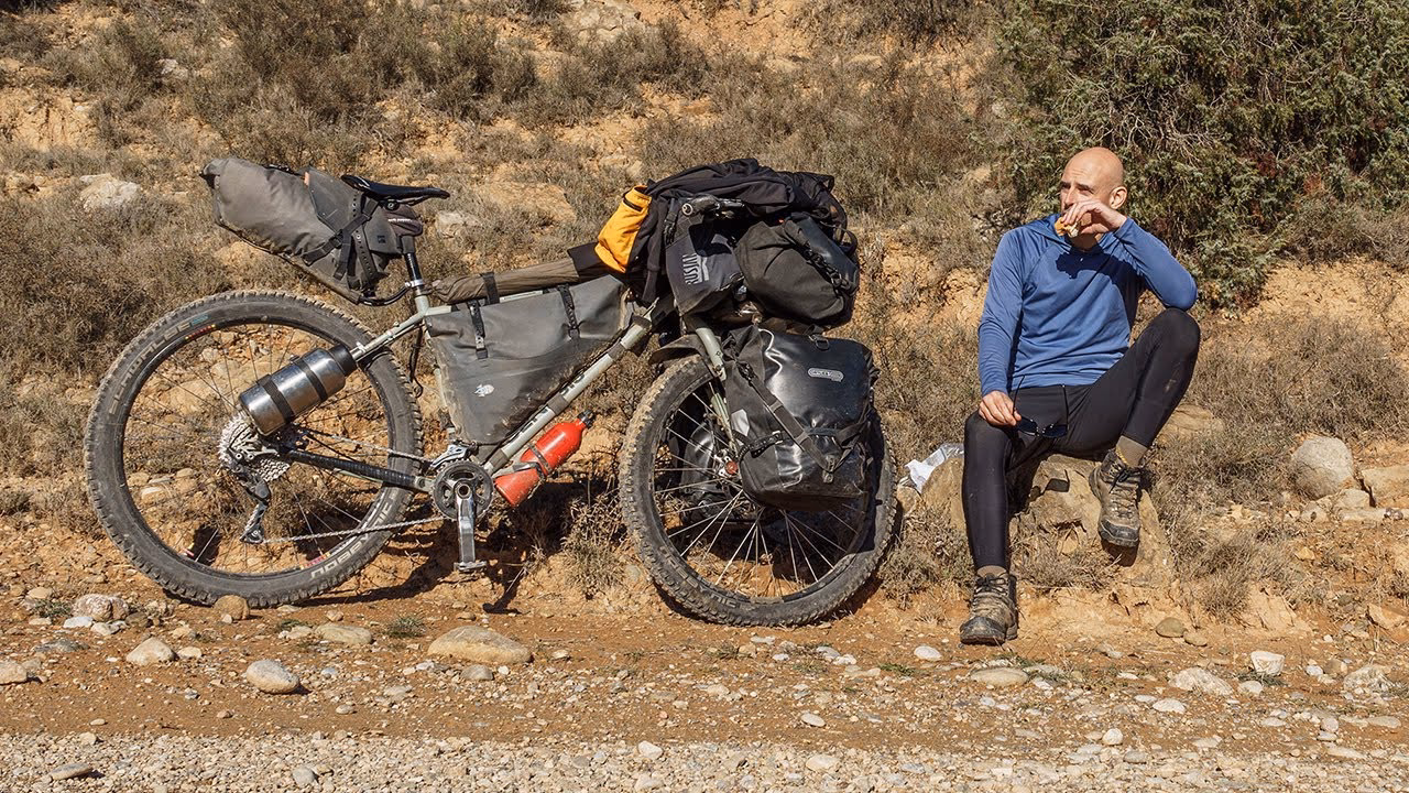 What is the difference between cycle touring and bikepacking?